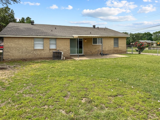 3837 Finley Rd, Irving, TX 75062 - back of property with central air condition unit, a patio, brick siding, and a shingled roof