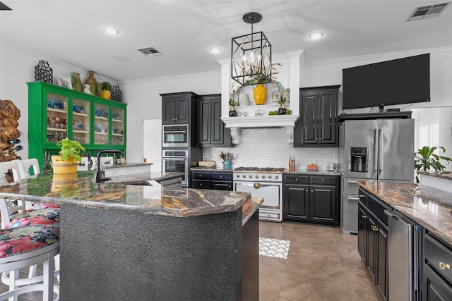 226 Northline Rd, Teague, TX 75860 - kitchen featuring appliances with stainless steel finishes, a sink, crown molding, dark cabinets, and backsplash
