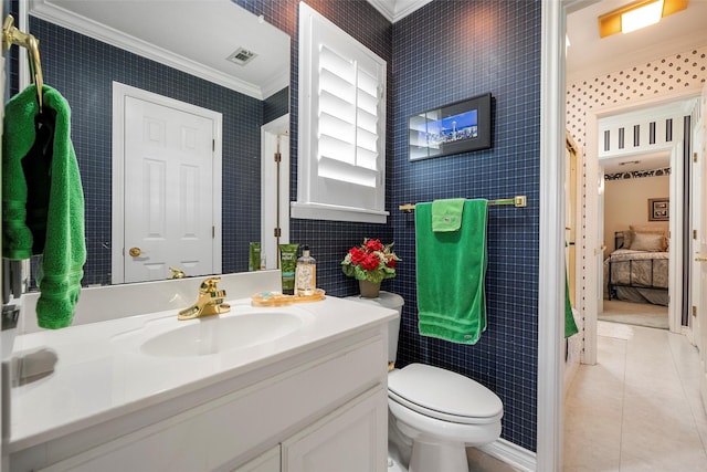 226 Northline Rd, Teague, TX 75860 - full bathroom with ornamental molding, tile patterned flooring, vanity, toilet, and ensuite bathroom