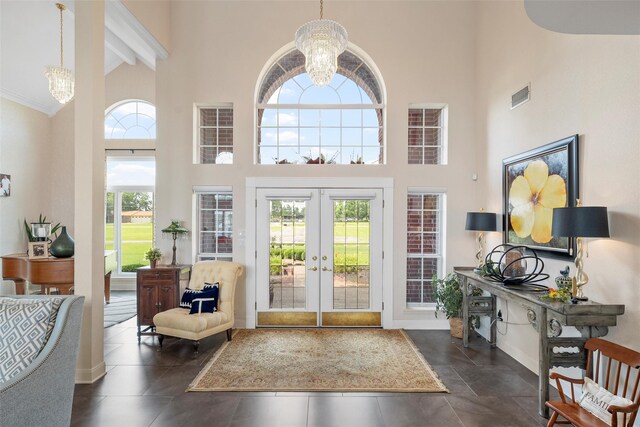 226 Northline Rd, Teague, TX 75860 - foyer entrance featuring high vaulted ceiling, a chandelier, beamed ceiling, french doors, and baseboards