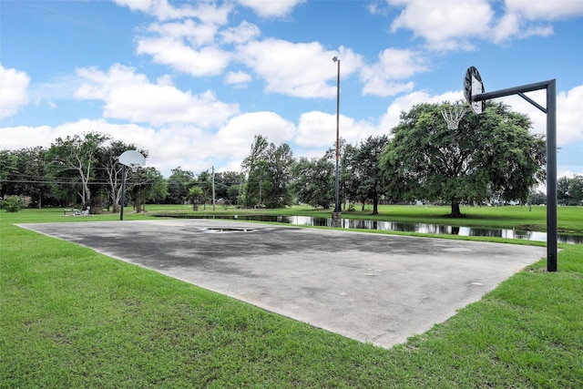 226 Northline Rd, Teague, TX 75860 - view of sport court featuring community basketball court, a lawn, a water view, and view of wooded area