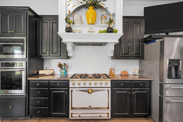 226 Northline Rd, Teague, TX 75860 - kitchen with stainless steel appliances, dark cabinets, backsplash, and crown molding