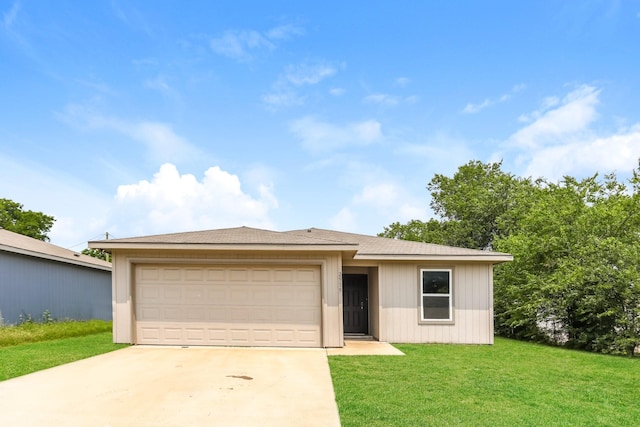 2515 Lyle Ave, Waco, TX 76708 - view of front of home with concrete driveway, a front yard, and an attached garage