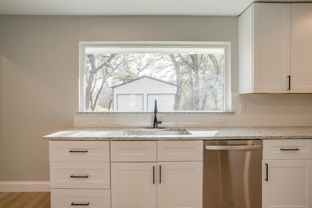 890 Nash Ln, Lipan, TX 76462 - kitchen featuring dishwasher, a sink, tasteful backsplash, and white cabinets