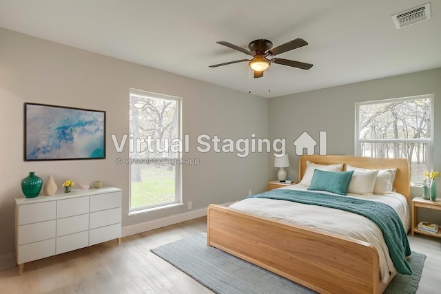 890 Nash Ln, Lipan, TX 76462 - bedroom with wood finished floors, multiple windows, baseboards, and ceiling fan