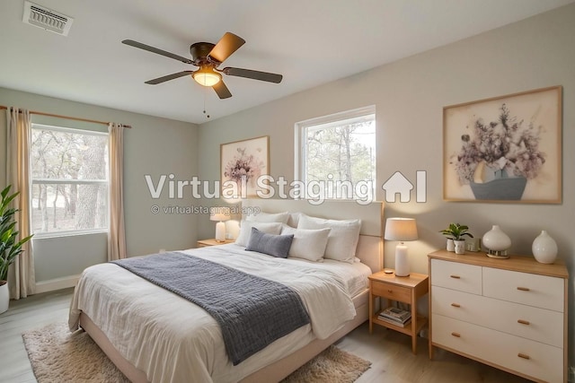 890 Nash Ln, Lipan, TX 76462 - bedroom with light wood-style floors, ceiling fan, and baseboards