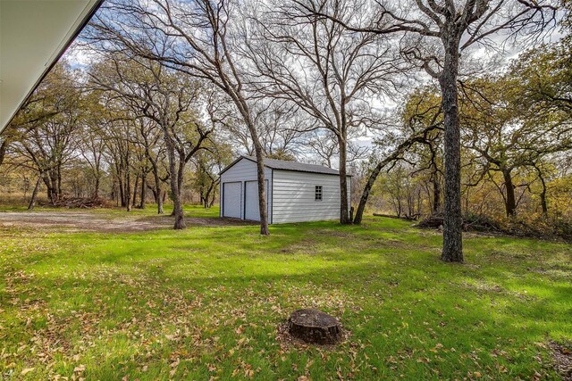890 Nash Ln, Lipan, TX 76462 - view of grassy yard with an outbuilding and a detached garage