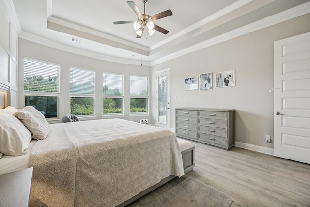 4871 Lockwood Dr, Prosper, TX 75078 - bedroom featuring light wood-type flooring, ornamental molding, a raised ceiling, and ceiling fan