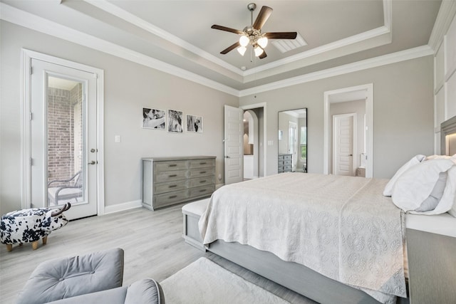 4871 Lockwood Dr, Prosper, TX 75078 - bedroom with a tray ceiling, light wood finished floors, crown molding, access to outside, and ensuite bathroom