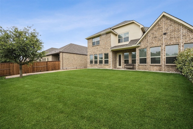 4871 Lockwood Dr, Prosper, TX 75078 - rear view of property featuring brick siding and a shingled roof