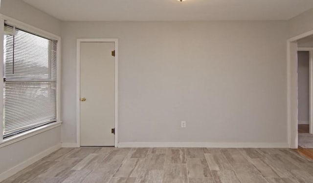 800 SE 16th St, Mineral Wells, TX 76067 - spare room featuring light wood-style floors and baseboards