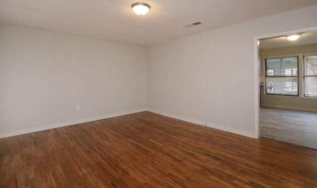 800 SE 16th St, Mineral Wells, TX 76067 - empty room with wood finished floors and baseboards