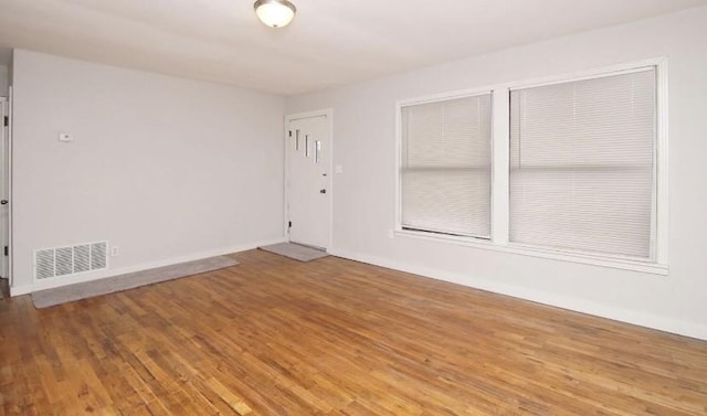 800 SE 16th St, Mineral Wells, TX 76067 - empty room with wood finished floors and baseboards