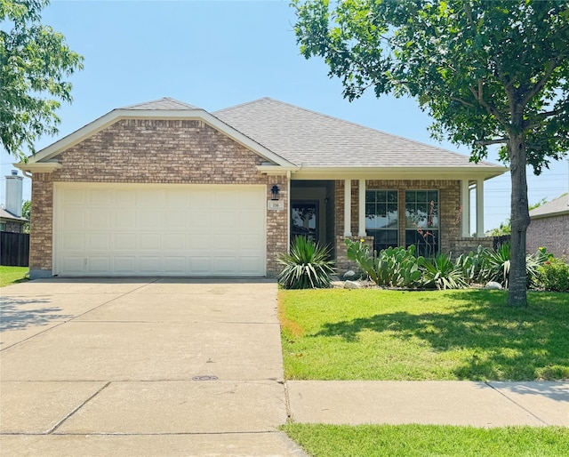 116 Bison Meadow Dr, Waxahachie, TX 75165 - view of front of home with concrete driveway, brick siding, a front yard, a garage, and roof with shingles