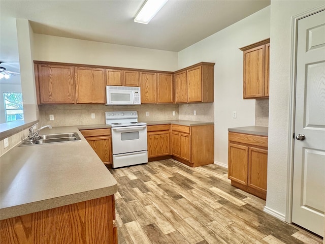 116 Bison Meadow Dr, Waxahachie, TX 75165 - kitchen with white appliances, a sink, tasteful backsplash, and light wood-style floors