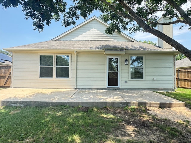 116 Bison Meadow Dr, Waxahachie, TX 75165 - rear view of house with a patio, a chimney, and roof with shingles