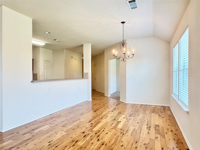 116 Bison Meadow Dr, Waxahachie, TX 75165 - empty room featuring hardwood / wood-style floors, a chandelier, healthy amount of natural light, baseboards, and lofted ceiling