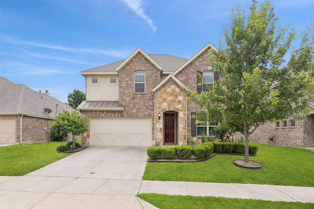 824 Water Garden Cir, Little Elm, TX 75068 - traditional-style home featuring concrete driveway, a garage, a front lawn, and a standing seam roof