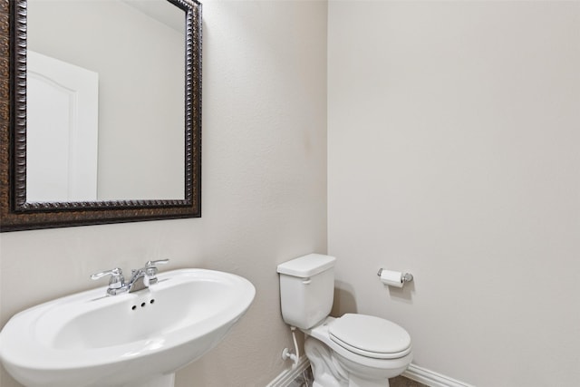 824 Water Garden Cir, Little Elm, TX 75068 - half bathroom with a sink and baseboards