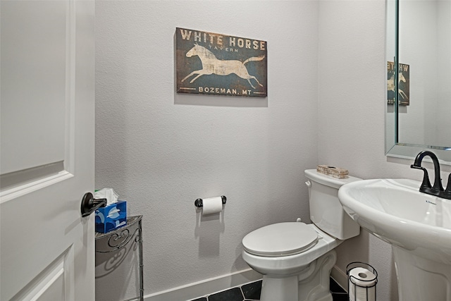 841 Emerling Dr, Mckinney, TX 75069 - half bathroom with toilet, tile patterned floors, and baseboards