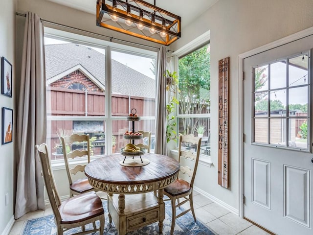 1676 Castle Pines Dr, Frisco, TX 75036 - dining space with light tile patterned floors and baseboards