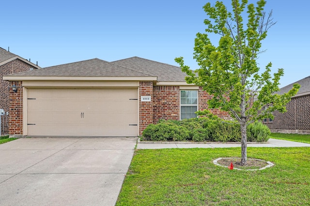 1112 Roman Dr, Princeton, TX 75407 - view of front of house with brick siding, a front yard, driveway, an attached garage, and a shingled roof