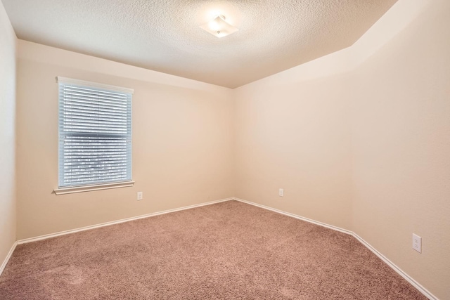 1112 Roman Dr, Princeton, TX 75407 - carpeted spare room with a textured ceiling and baseboards