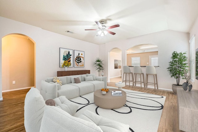 1112 Roman Dr, Princeton, TX 75407 - living area with arched walkways, a ceiling fan, wood finished floors, and baseboards