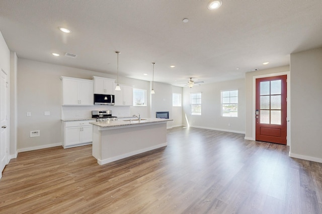 1800 Summer Aura, Mesquite, TX 75181 - kitchen with appliances with stainless steel finishes, recessed lighting, ceiling fan, baseboards, and open floor plan