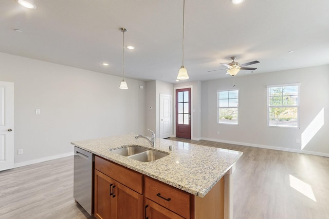 1808 Summer Aura, Mesquite, TX 75181 - kitchen with stainless steel dishwasher, a sink, light wood-type flooring, pendant lighting, and recessed lighting