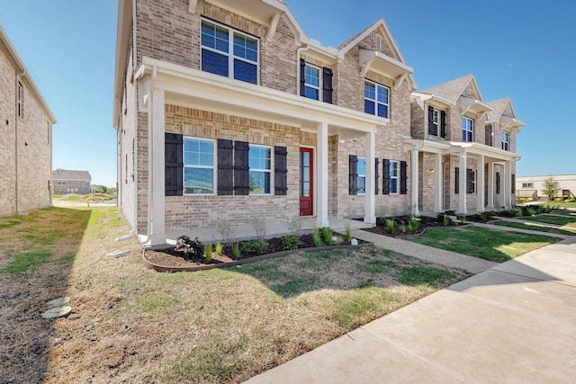 1804 Summer Aura, Mesquite, TX 75181 - view of front of house with brick siding, a front lawn, and a residential view