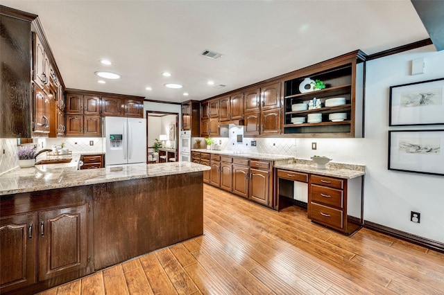 1345 Meadow Gln, Southlake, TX 76092 - kitchen featuring white appliances, open shelves, decorative backsplash, light stone countertops, and recessed lighting