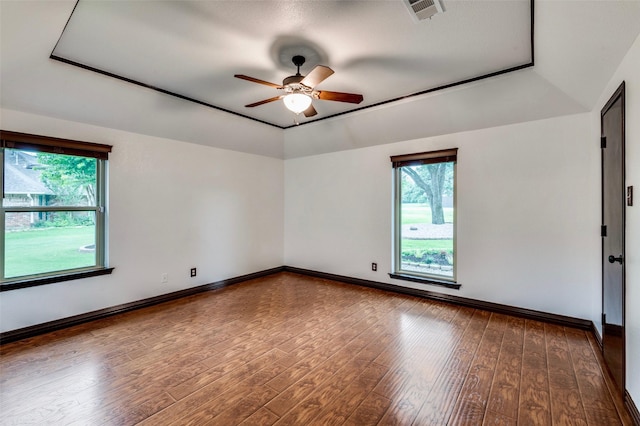 1345 Meadow Gln, Southlake, TX 76092 - unfurnished room with a ceiling fan, wood-type flooring, a raised ceiling, and baseboards