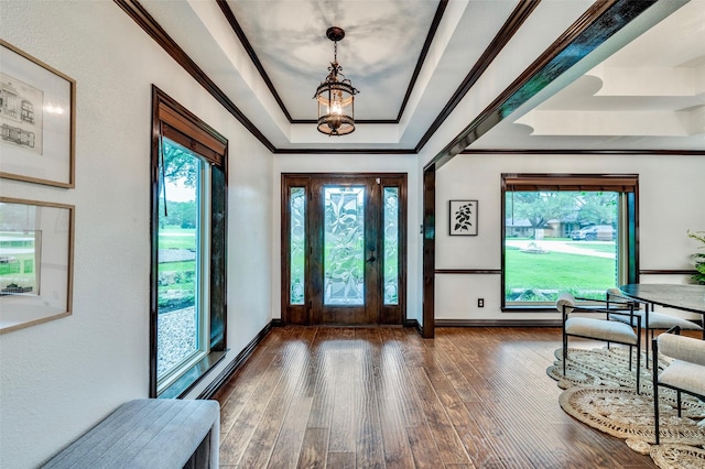 1345 Meadow Gln, Southlake, TX 76092 - entrance foyer featuring a raised ceiling, wood-type flooring, plenty of natural light, baseboards, and crown molding