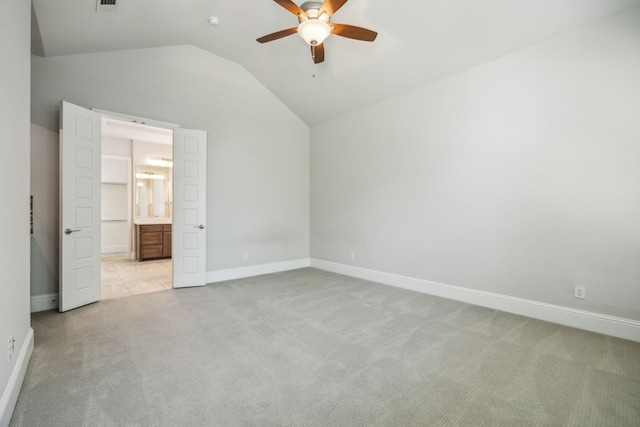 975 Stampede Dr, Frisco, TX 75036 - unfurnished bedroom featuring light colored carpet, vaulted ceiling, baseboards, ensuite bathroom, and ceiling fan
