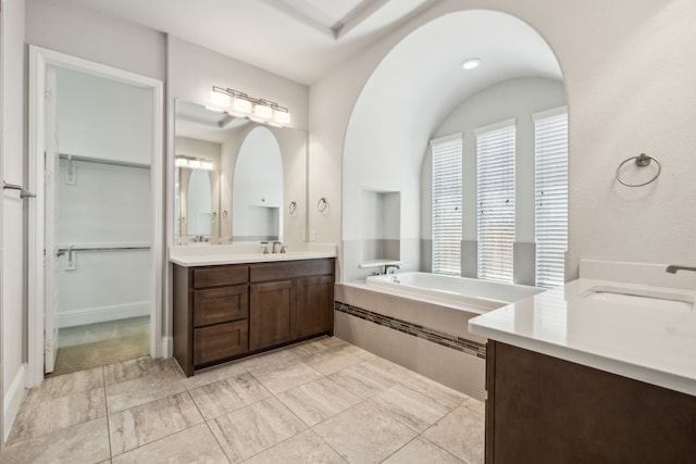 975 Stampede Dr, Frisco, TX 75036 - full bath with two vanities, a bath, and a spacious closet