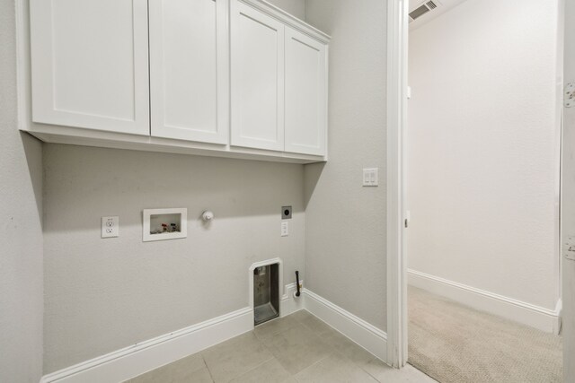 975 Stampede Dr, Frisco, TX 75036 - laundry room featuring gas dryer hookup, cabinet space, hookup for an electric dryer, baseboards, and washer hookup