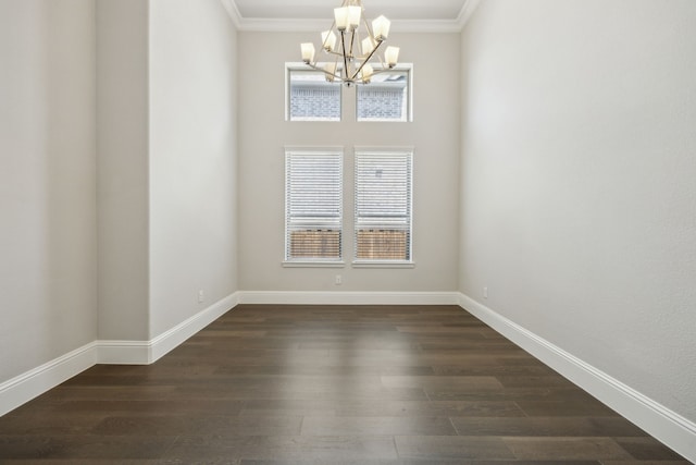 975 Stampede Dr, Frisco, TX 75036 - spare room featuring a chandelier, plenty of natural light, dark wood-style flooring, and ornamental molding