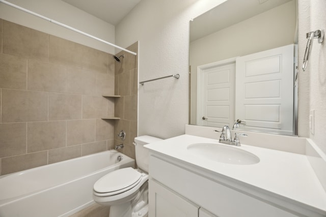975 Stampede Dr, Frisco, TX 75036 - full bathroom with a textured wall, toilet, vanity, and shower / bath combination