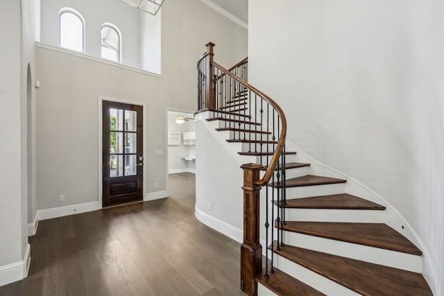 975 Stampede Dr, Frisco, TX 75036 - entrance foyer with wood finished floors, stairs, baseboards, and a high ceiling