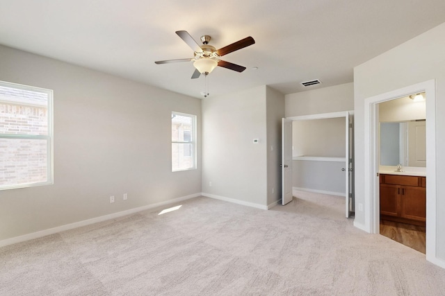 1812 Summer Aura, Mesquite, TX 75181 - unfurnished bedroom featuring light colored carpet, baseboards, a sink, ensuite bathroom, and a ceiling fan