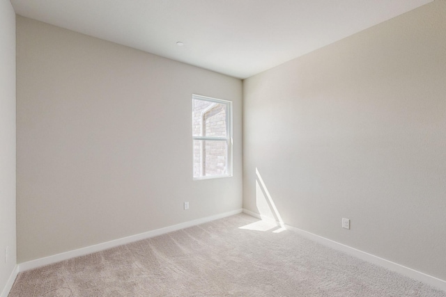 1812 Summer Aura, Mesquite, TX 75181 - spare room featuring light carpet and baseboards