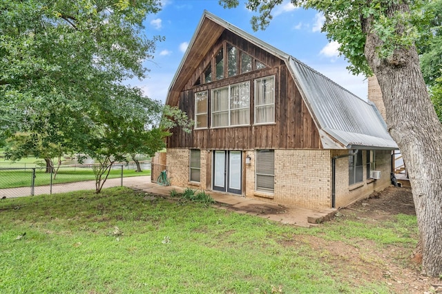 107 Oak Acres Dr W, Malakoff, TX 75148 - back of house with brick siding, metal roof, and cooling unit