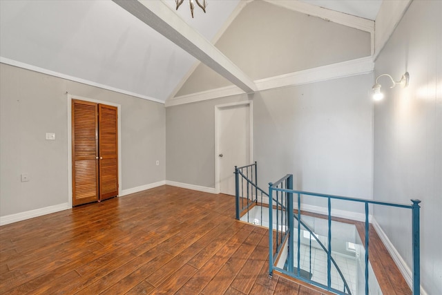 107 Oak Acres Dr W, Malakoff, TX 75148 - spare room with lofted ceiling, wood finished floors, and baseboards