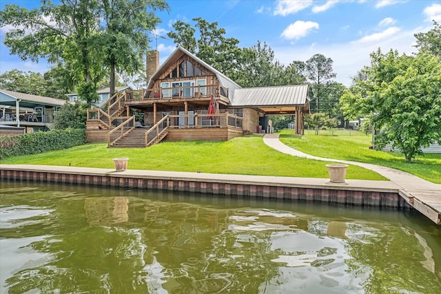 107 Oak Acres Dr W, Malakoff, TX 75148 - back of property with a chimney, a deck with water view, and a lawn