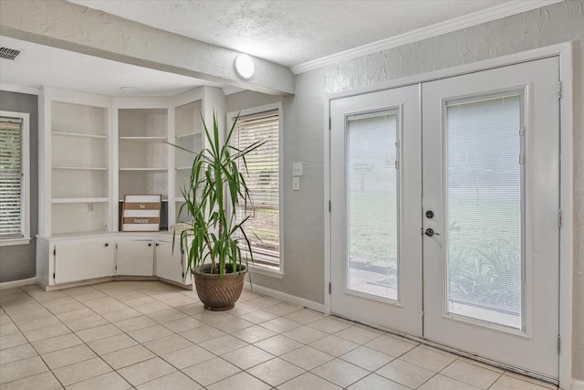107 Oak Acres Dr W, Malakoff, TX 75148 - doorway featuring french doors, crown molding, a textured wall, built in features, and baseboards