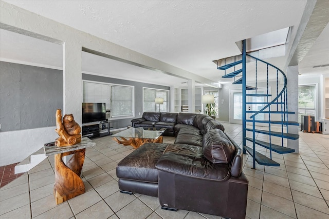 107 Oak Acres Dr W, Malakoff, TX 75148 - living room featuring tile patterned floors, stairway, a textured ceiling, and a textured wall