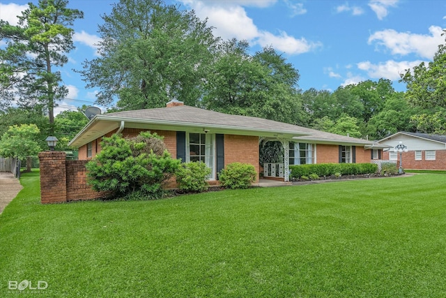 5918 Fern Ave, Shreveport, LA 71105 - ranch-style home with brick siding, a front lawn, french doors, and a chimney