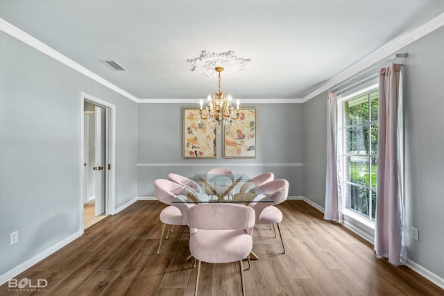 5918 Fern Ave, Shreveport, LA 71105 - dining area with a chandelier, wood finished floors, baseboards, and crown molding