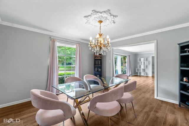 5918 Fern Ave, Shreveport, LA 71105 - dining area featuring a chandelier, crown molding, healthy amount of natural light, baseboards, and wood finished floors